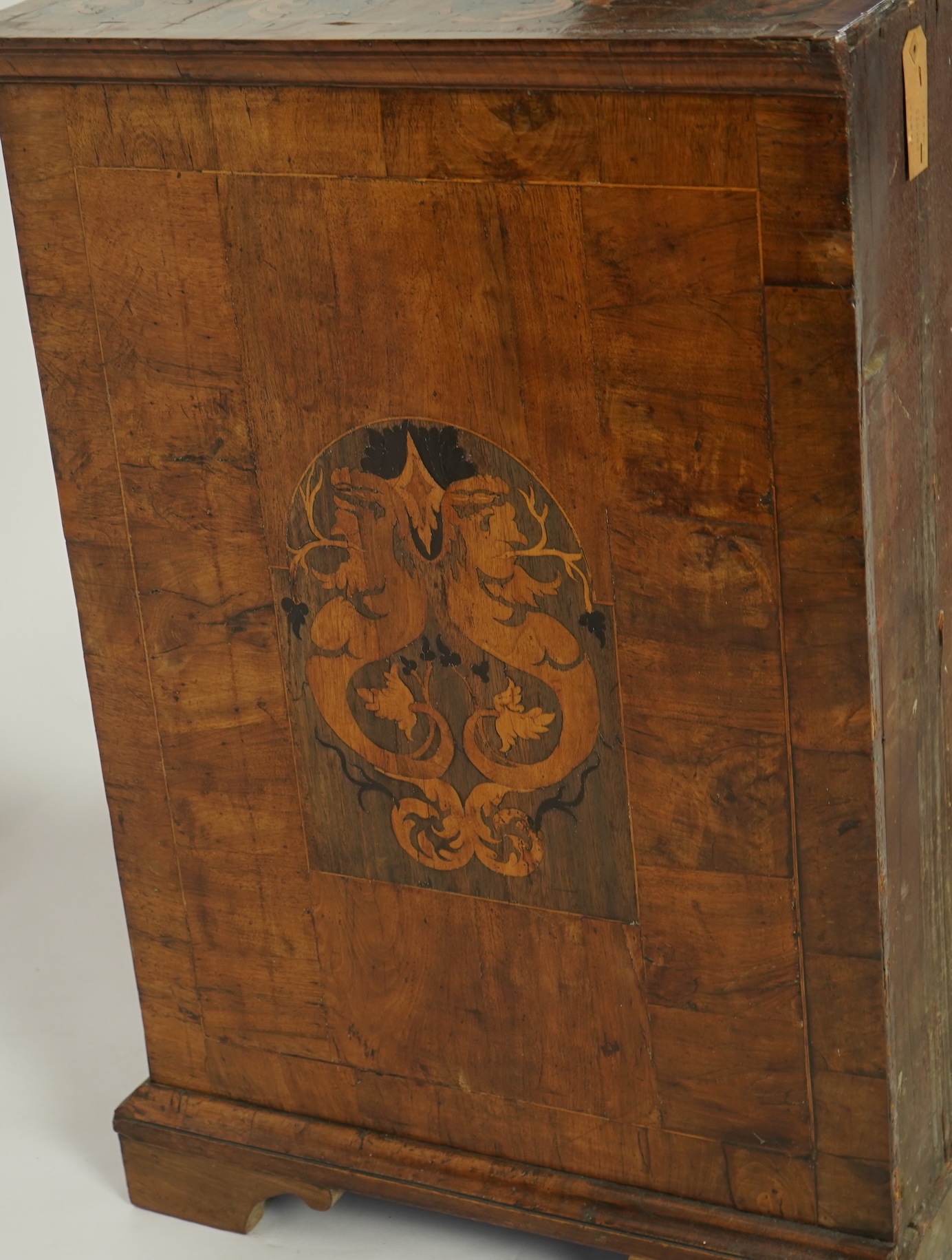 A William and Mary walnut and floral marquetry chest on later bracket feet